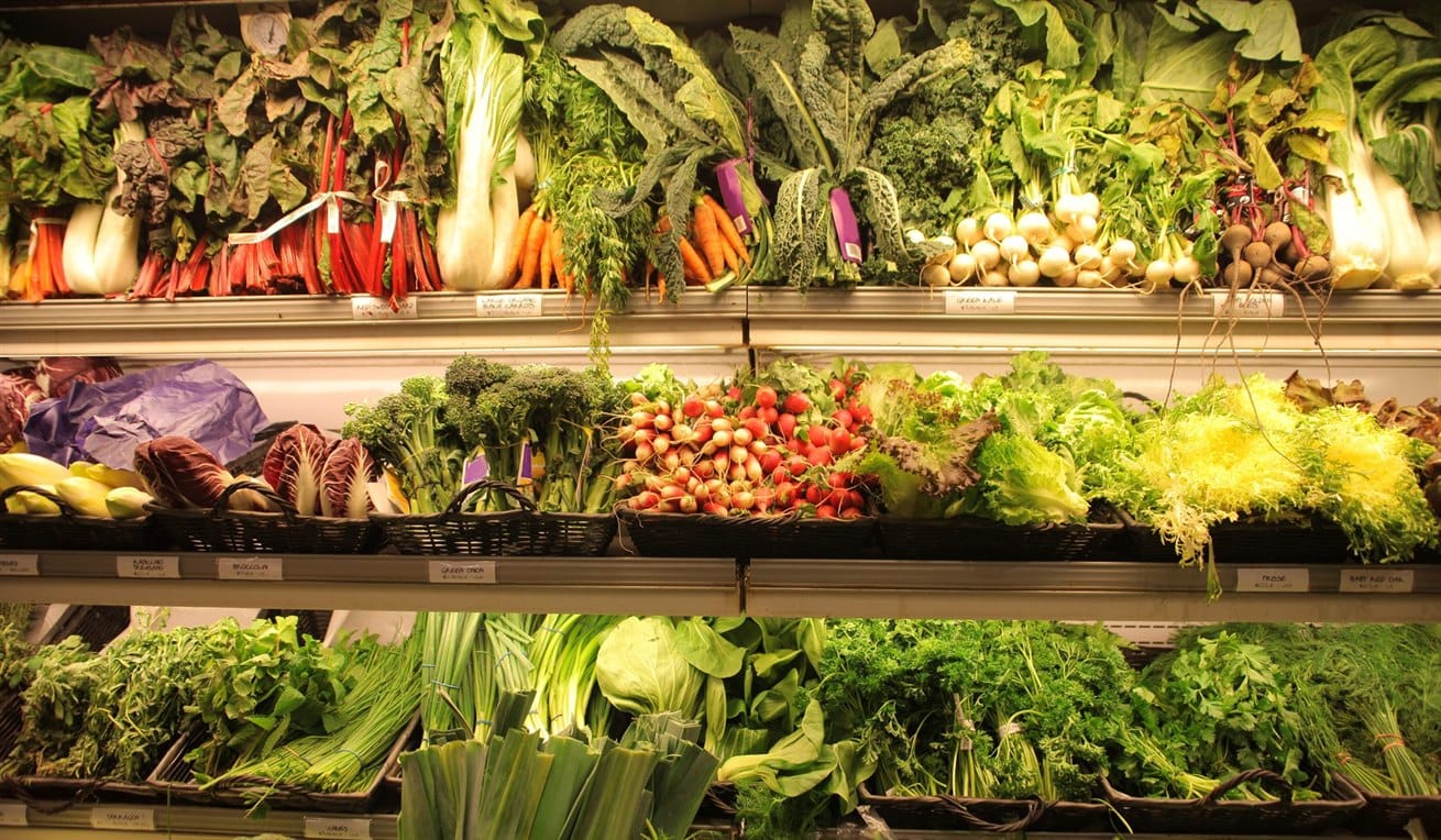 Supermarket shelves full of fresh fruit and vegetables with lower chemical residues